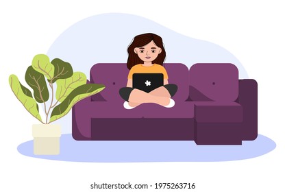 The girl works at the computer in the room. Freelance woman at home schooling.