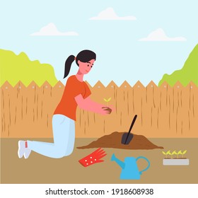the girl works in the garden, planting flowers