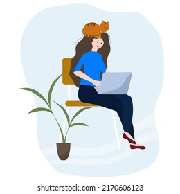 The girl works at a laptop in a cozy environment with a cat and a green plant. 