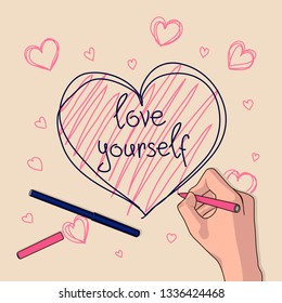 The girl writes with her hand on the paper the phrase "love yourself." Painted heart. Creative process.