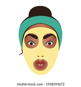 The girl in the yellow mask. Facial skin care. Close-up of the girl's face. Cosmetic procedures.
