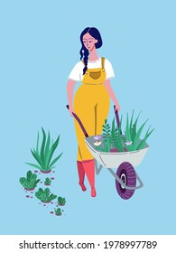 Girl in yellow overalls carrying wheelbarrow with plants and flowers outdoor. Home hobby. Garden work. Florist taking care of plant. Colorful vector illustration. Cartoon style. Blue background.