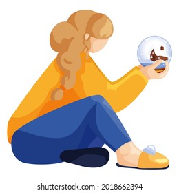 A girl in a yellow sweater and blue pants sits with a magic ball. Dreaming girl