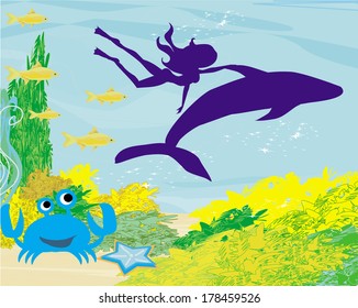 The girl-diver floats together with a dolphin 