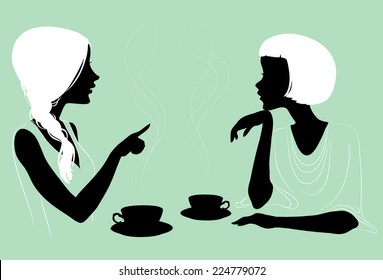 Girlfriends enjoys a hot tea in the cafe with two cups, silhouettes.