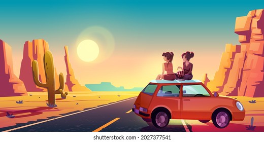 Girlfriends On Car Roof Admire Beautiful Sunset