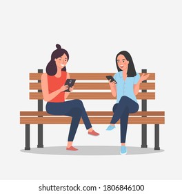 Girlfriends are sitting on the bench with smartphones. Vector flat cartoon style illustration