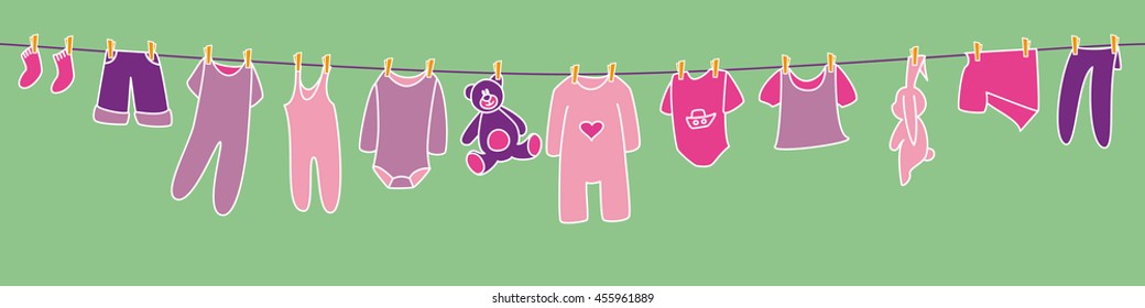 Girls' clothes and toys drying on the clothesline. Banner.