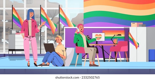 girls discussing during meeting and using laptop lgbt rainbow flag transgender love generation Z concept modern office interior