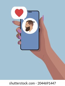Girl's hand with smartphone and speech bubble with heart. Guy face avatar. Hand holding smartphone. Blue background. Flat illustration.