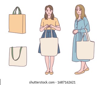 The girls are holding eco bags. hand drawn style vector design illustrations. 