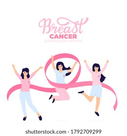 Girls with pink ribbons jump and have fun. National Breast Cancer Awareness Month.