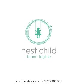 Girls play on a swing that has a place like a bird's nest