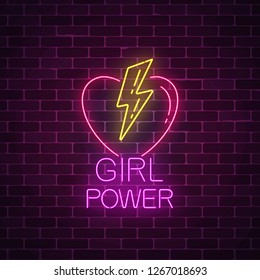 Girls power sign in neon style on dark brick wall background. Glowing symbol of female slogan with heart and lightning shapes. Women rights. Vector illustration.