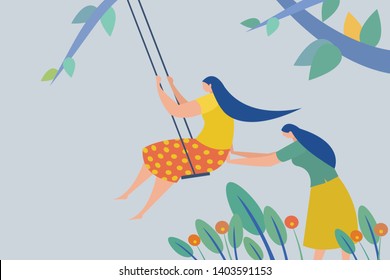 Girls swinging in the garden