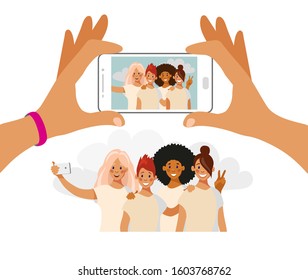 Girls take pictures on the phone. A group of friends of different nationalities is photographed. Selfie best friends. Cartoon vector isolated on white.