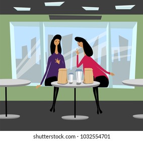 girls talking in a cafe