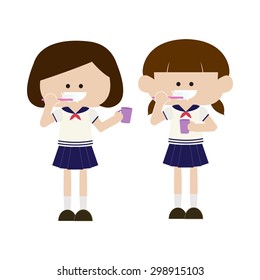 Girls in uniform brushing teeth