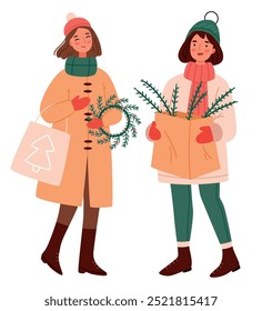 Girls in winter clothes with Christmas decorations and gifts. Girlfriends on Christmas shopping. Sale.