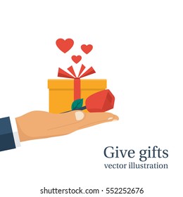 Give gifts. Isolated on white background. Gift box with ribbon and red rose hold in hand man. Vector illustration flat design. Romantic surprise for Valentine's Day. Congratulation. Love greetings.