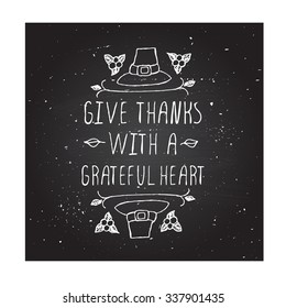 Give thanks with a grateful heart. Hand sketched graphic vector element with pilgrim hat and text on chalkboard background.  Thanksgiving design.