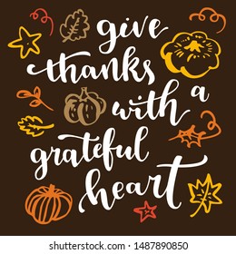 Give thanks with a grateful heart. Thanksgiving quote. Fall modern calligraphic hand drawn greeting card with pumpkin and leaves. Autumn colored artwork, print, artistic vector illustration