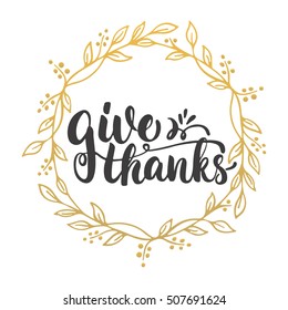 Give thanks - lettering calligraphy phrase with leaves on the background with golden wreath. Autumn Thanksgiving Day greeting card
