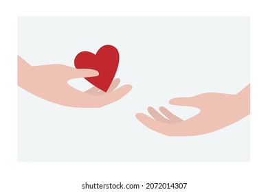 Giving a heart from one hand to another. Concept of love or charity.