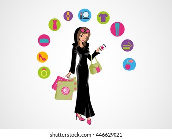 Glamorous Arab girl standing in her traditional Arabic dress holding shopping bags and her hand bag. On-line shopping in Arab world