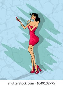 Glamorous lady in red dress and red shoes makes selfie on her phone