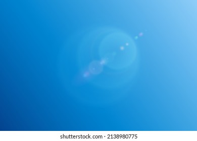 glare circles sun rays on blue sky