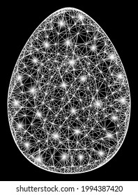 Glare crossing mesh egg carcass with light spots. Illuminated vector carcass created from egg icon and crossing white lines. Sparkle carcass wired egg, on a black backgound.