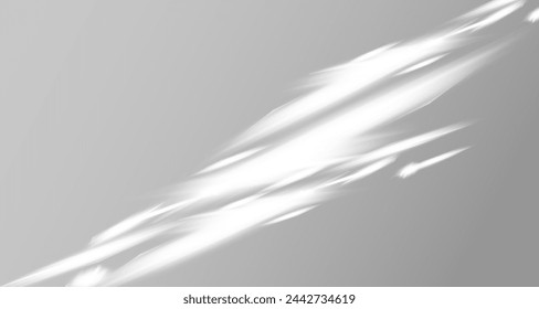 Glare from the sun's rays on the wall. Blurred shadows from leaves and plants in the room. Soft overlay of natural light. Abstract background for product presentation.Natural light layout.