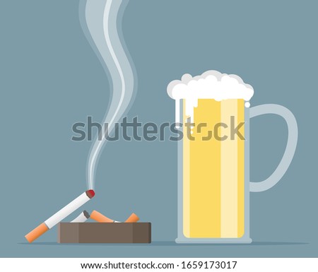 Glass of beer with cigarette and ashtray.