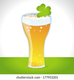 Glass of beer with clover. Saint Patrick's Day decoration. Design element.