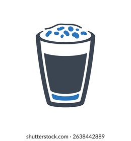 A glass of beer with foam.