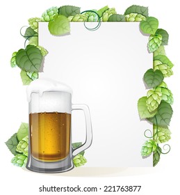 Glass of beer with foam cap and white background decorated with green hops branch. Abstract Oktoberfest background