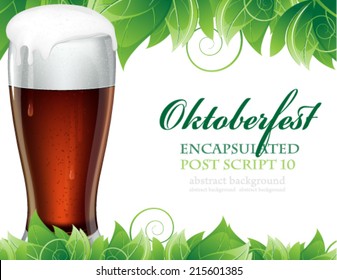 Glass of beer with foam on a background of green leaves