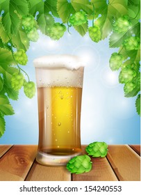 glass of beer and hops