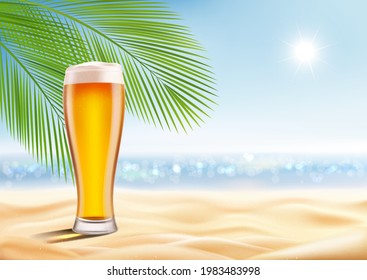 Glass of beer on sand, on beach, summer vacation, sea and sky.