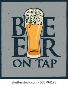 Glass of beer on tap with foam