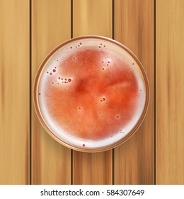 Glass of beer on a wooden surface. Top view. EPS10 vector