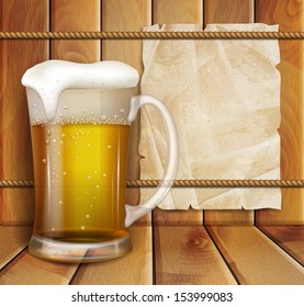 glass of beer and a wooden background
