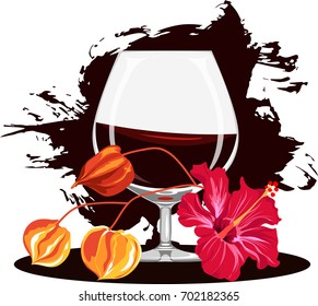 a glass of brandy and flowers