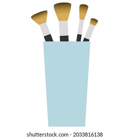glass with brushes on white background