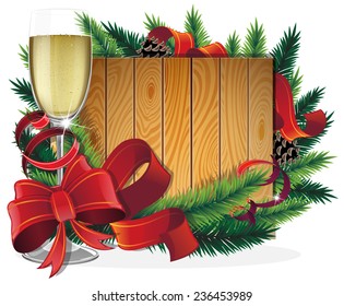 Glass of champagne, Christmas ribbons and fir tree branches on wooden background