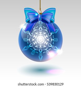 glass Christmas ball with a blue bow with snowflake on a light background