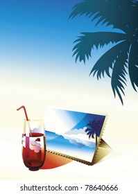 Glass of coctail and photo on the beach.