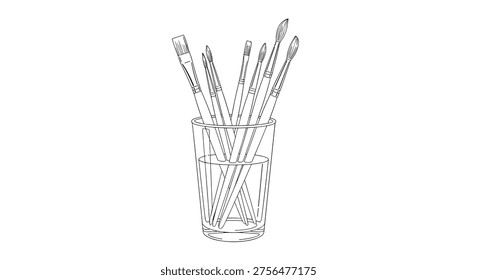 A glass cup filled with several paint brushes
