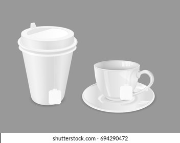 Glass cup with saucer and paper coffee cup. Tea bag.